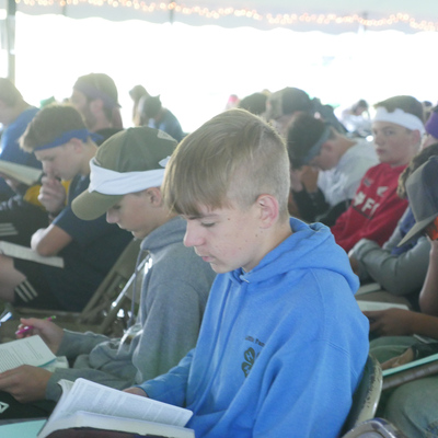 Campers at CVFJ with their Bibles during teaching time
