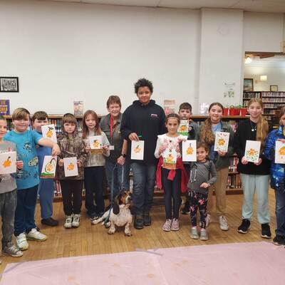 Our paw print pumpkins with Bud the therapy dog.