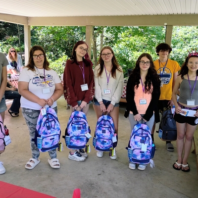 Mentees in attendance at back to school picnic with backpacks