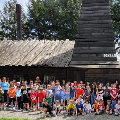 Students visiting the replica of Drake's Well