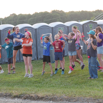 Campers at CVFJ working together to form a skit to present to the group