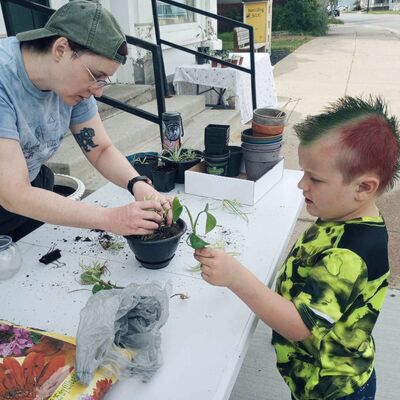 Miss Lauren and Lincoln potting houseplant cuttings during our Mother's Day Plant Swap!