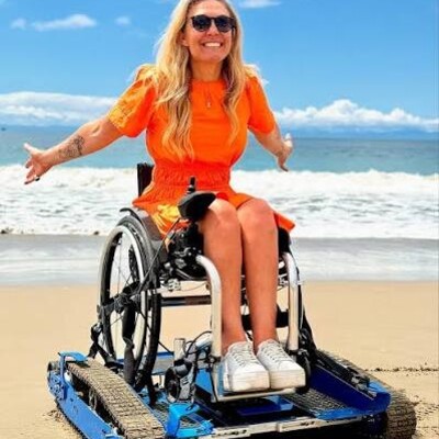 Portable, motorized track system transforms your manual wheelchair into a rugged off-road wheelchair