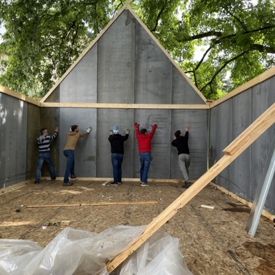 Lifting a wall on the pilot cottage