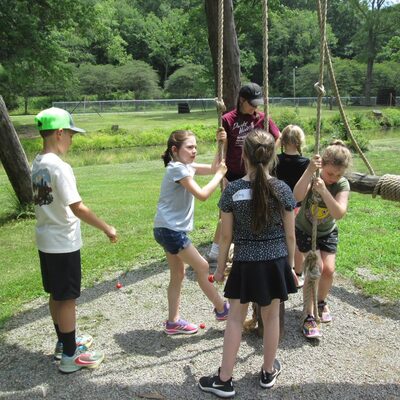 Students enjoying the Spring Pole Drilling Rig on the grounds of Drake Well Museum.