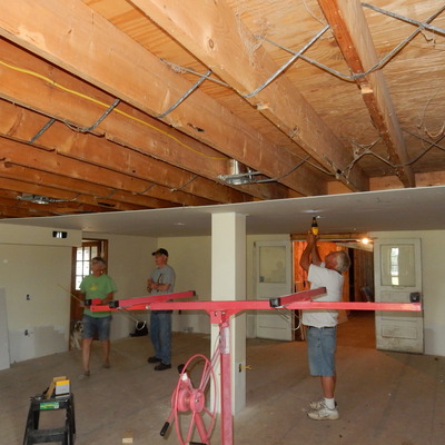 Bernie Hanmore, Dan Pfeiffer, Rich Roberts & John Snyder install ceiling & lights in Main Gallery