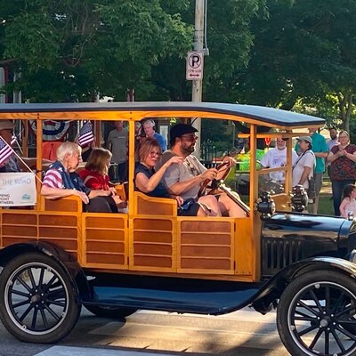 Millie Woge, the Grand Marshall, riding in the parade for America's 250th.