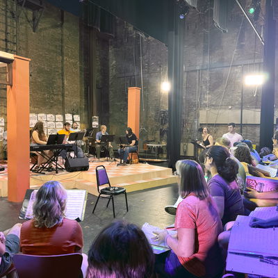 The Grease cast and band rehearse together for the first time.