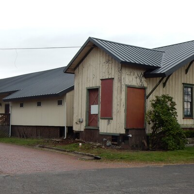 Front & west side of Depot's exterior showing New Roof installed in 2019.
