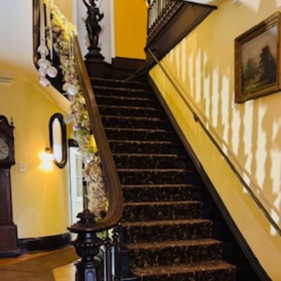 The Grand Entrance of the Baldwin Reynolds House decorated for Trees of Christmas 2024