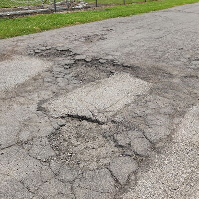 Childcare Parking lot crumbling area