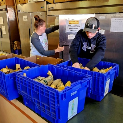 Staff unloading donated venison at a local food pantry