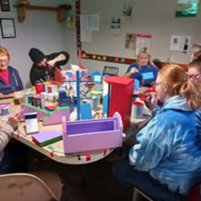 Lowe s employees volunteering at Toy Shoppe